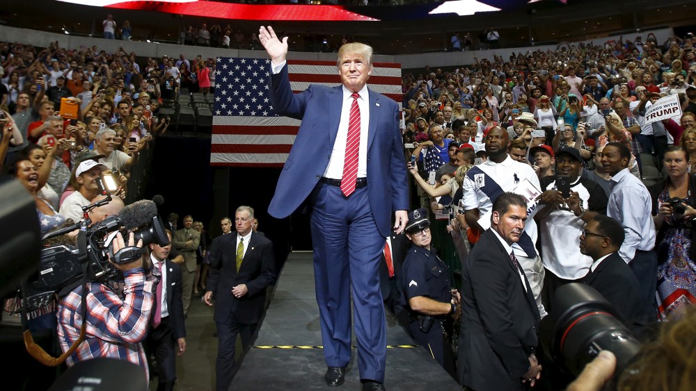 Republican presidential candidate Donald Trump enter the arena for a rally in Dallas, Texas Sept. 14, 2015. (Photo by Mike Stone/Reuters)