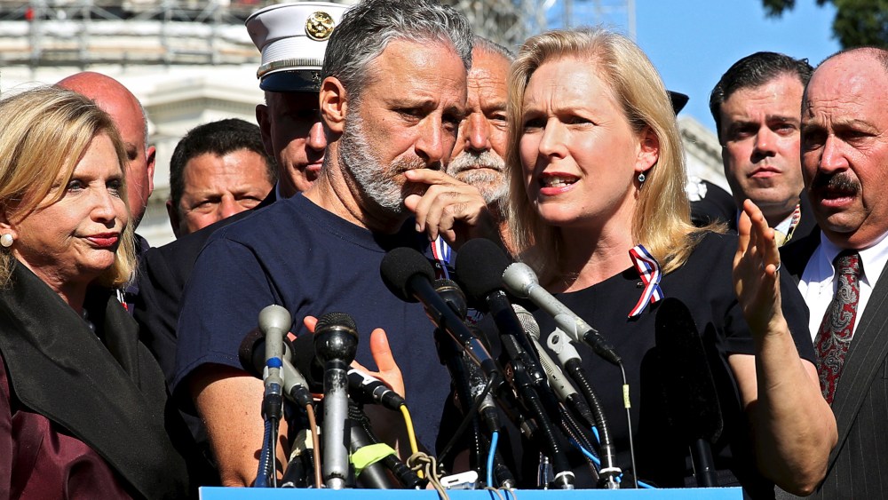 Comedian Jon Stewart listens to Senator Kirsten Gillibrand (D-NY) at an event to urge U.S. lawmakers to re-authorize the Zadroga Bill at the U.S. Capitol in Washington, Sept. 16, 2015. (Photo by Gary Cameron/Reuters)