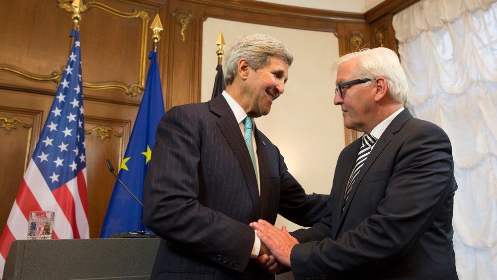 German Foreign Minister Frank-Walter Steinmeier and U.S. Secretary of State John Kerry in Berlin, Sept. 20, 2015, announce that the U.S. will take in 15,000 more refugees next year, increasing the current level to 85,000. (Photo by Axel Schmidt/Reuters)