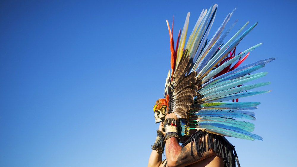 A reveler gets ready to dance during a "pow-wow" celebrating the Indigenous Peoples' Day Festival in Randalls Island, New York, Oct. 11, 2015. (Photo by Eduardo Munoz/Reuters)