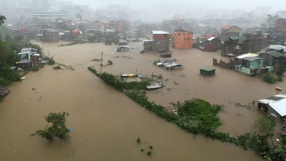 Houses, partially submerged in floods waters caused by heavy rains brought by Typhoon Koppu, are seen in City Camp Lagoon at Baguio city, north of Manila, Oct. 19, 2015. (Photo by Harley Palangchao/Reuters)