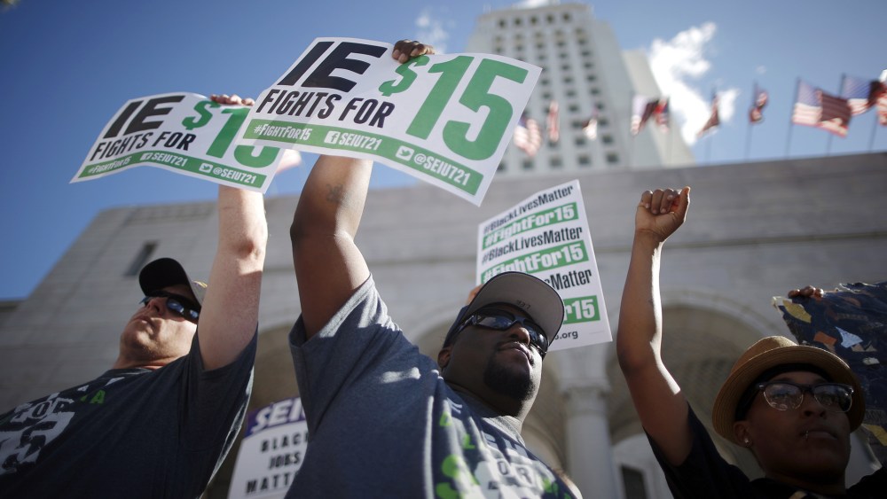 Fast-food workers and their supporters join a nationwide protest for higher wages and union rights outside City Hall in Los Angeles, Calif, Nov. 10, 2015. (Photo by Lucy Nicholson/Reuters