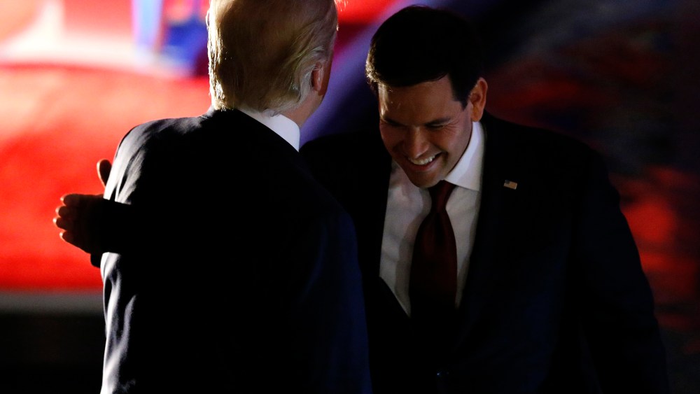 Marco Rubio pats Donald Trump on the back by during a commercial break at the debate held by Fox Business Network for the top 2016 U.S. Republican presidential candidates in Milwaukee, Wis., Nov. 10, 2015. (Photo by Jim Young/Reuters)