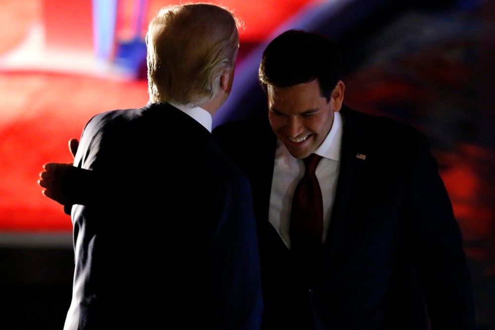 Marco Rubio pats Donald Trump on the back by during a commercial break at the debate held by Fox Business Network for the top 2016 U.S. Republican presidential candidates in Milwaukee, Wis., Nov. 10, 2015. (Photo by Jim Young/Reuters)