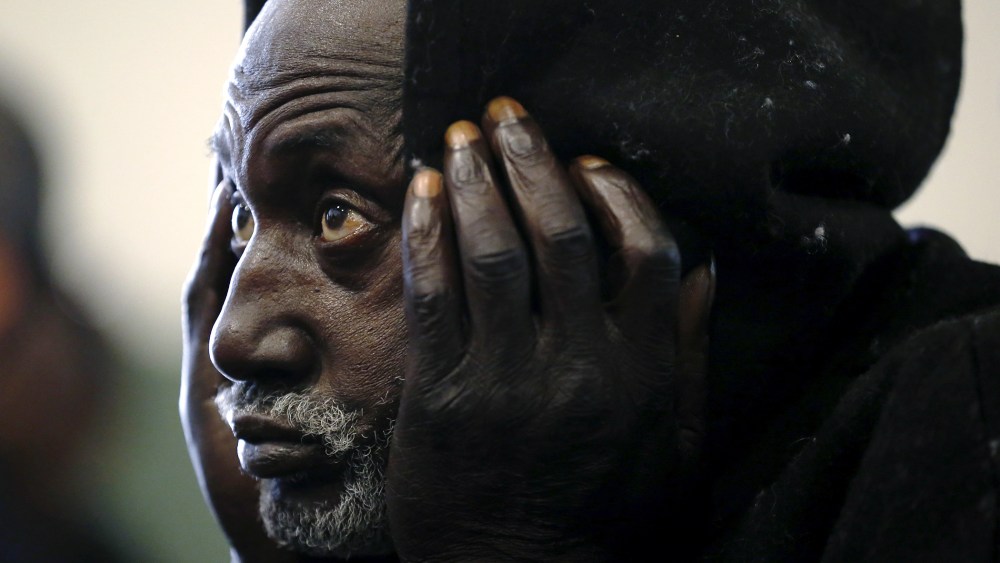 Army veteran Walter Shof, 53, listens to speakers at a Veterans Day ceremony at the Midnight Mission homeless shelter in Los Angeles, Calif., Nov. 11, 2015. (Photo by Lucy Nicholson/Reuters)