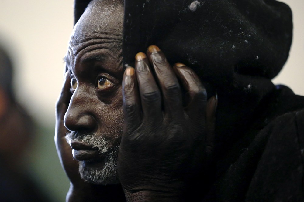 Army veteran Walter Shof, 53, listens to speakers at a Veterans Day ceremony at the Midnight Mission homeless shelter in Los Angeles, Calif., Nov. 11, 2015. (Photo by Lucy Nicholson/Reuters)