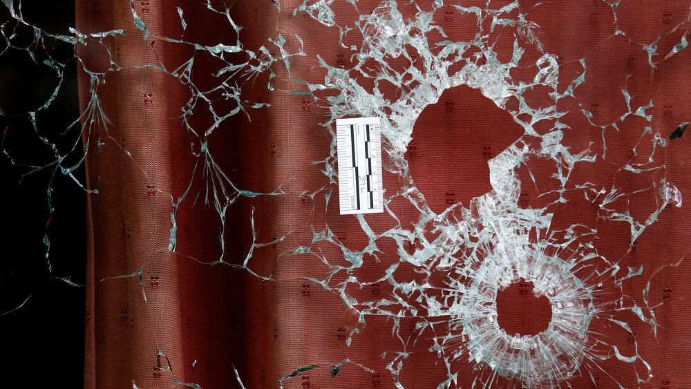 Bullet impacts are seen in the window of the Le Carillon restaurant the morning after a series of deadly attacks in Paris, Nov. 14, 2015. (Photo by Christian Hartmann/Reuters)