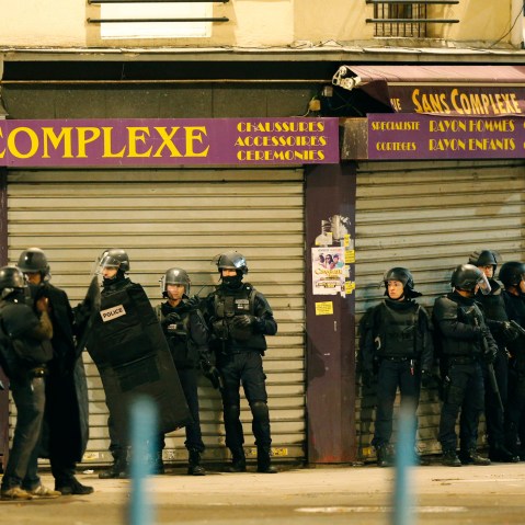 French special police forces secure the area as shots are exchanged in Saint-Denis, France, near Paris, Nov. 18, 2015 during an operation to catch fugitives. (Photo by Christian Hartmann/Reuters)