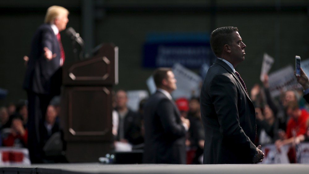 A member of the secret Service guard Republican presidential candidate Donald Trump as he attends a campaign rally in Warren, Mich., March 4, 2016. (Photo by Carlos Barria/Reuters)
