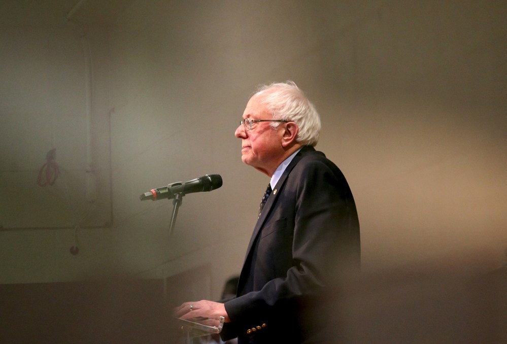 Vermont Senator and Democratic U.S. presidential candidate Bernie Sanders is seen through a window as he speaks at a town hall forum at the Olivet Institutional Baptist Church in Cleveland, Ohio, March 5, 2016. (Photo by Aaron Josefczyk/Reuters)