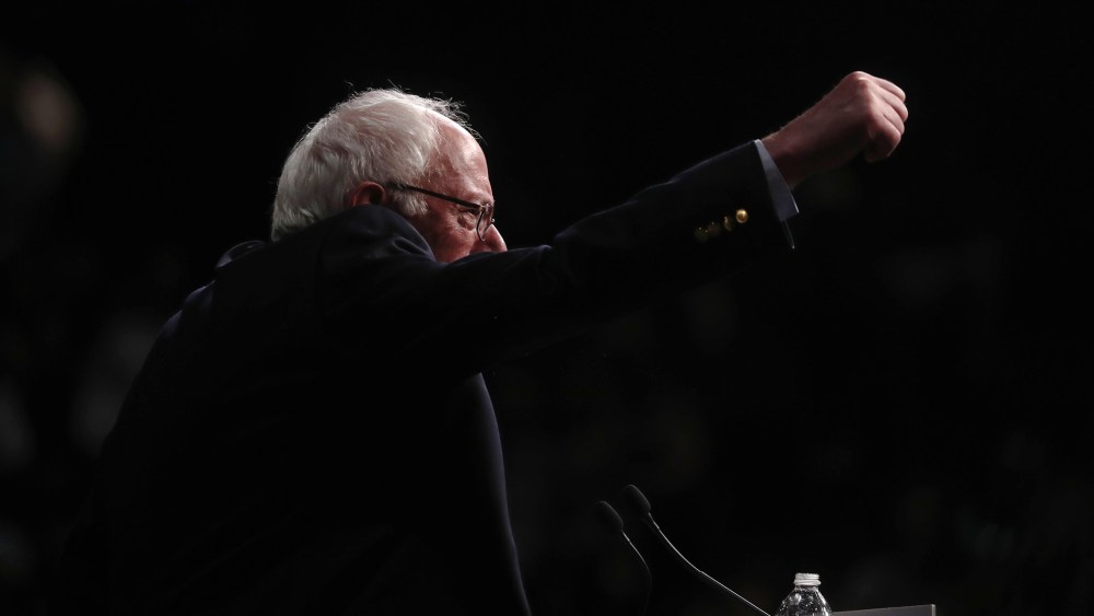 Democratic presidential candidate Senator Bernie Sanders punches the air as he speaks to supporters on the night of various primaries at his campaign rally in Miami, Fla., March 8, 2016. (Photo by Carlo Allegri/Reuters)