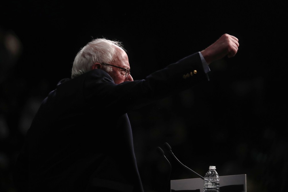 Democratic presidential candidate Senator Bernie Sanders punches the air as he speaks to supporters on the night of various primaries at his campaign rally in Miami, Fla., March 8, 2016. (Photo by Carlo Allegri/Reuters)