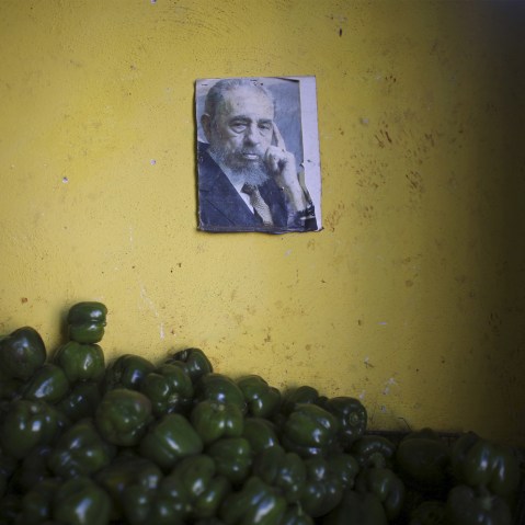 A photograph of Cuba's former President Fidel Castro decorates a wall inside a state-run market in Havana, March 8, 2016. (Photo by Alexandre Meneghini/Reuters)