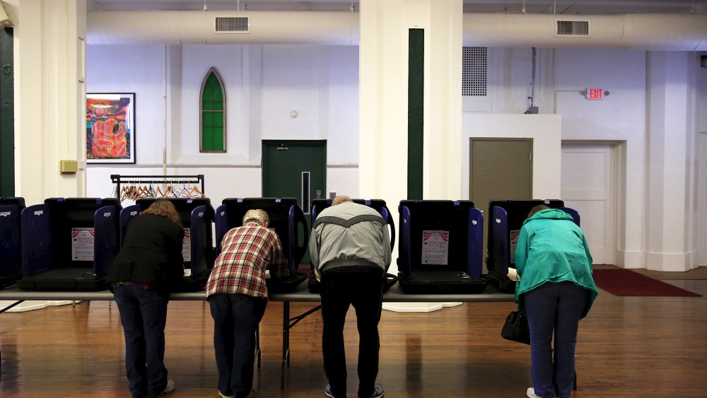 Voters cast their ballots for the Ohio primary at Saint Patrick's Social Hall in Youngstown, Ohio, March 15, 2016. (Photo by Aaron Bernstein/Reuters)