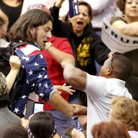 A member of the audience (R) throws a punch at a protester as Republican Presidential candidate Donald Trump speaks during a campaign event in Tucson, Ariz., March 19, 2016. (Photo by Sam Mircovich/Reuters)