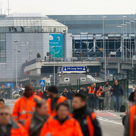 People leave the scene of explosions at Zaventem airport near Brussels, Belgium, March 22, 2016. (Photo by Francois Lenoir/Reuters)