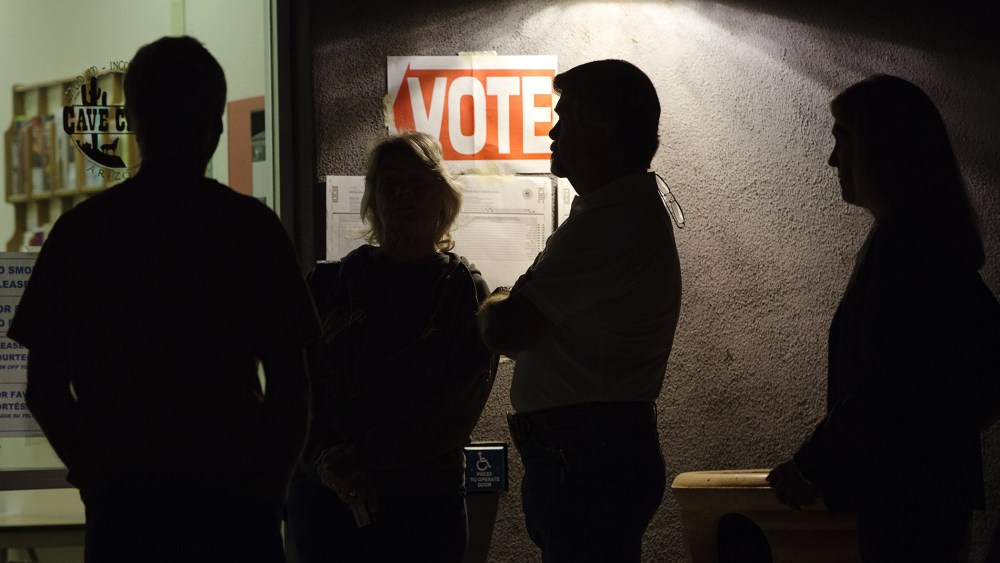 Early morning voters stand in line before sunrise to vote in Arizona's presidential primary election at a polling station in Cave Creek, Ariz., March 22, 2016. (Photo by Nancy Wiechec/Reuters)