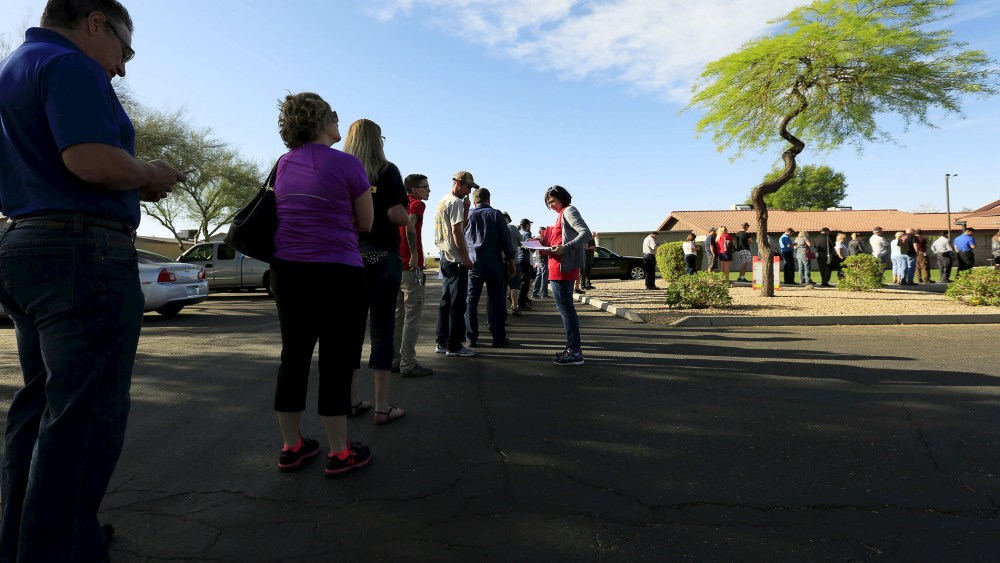 People wait to vote in the U.S. presidential primary election outside a polling site in Glendale, Ariz. on March 22, 2016. (Photo by Nancy Wiechec/Reuters)