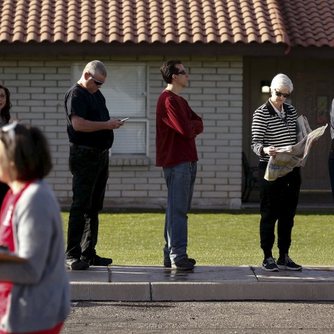 People wait to vote in the presidential primary election outside a polling site in Glendale, Ariz., March 22, 2016. (Photo by Nancy Wiechec/Reuters)