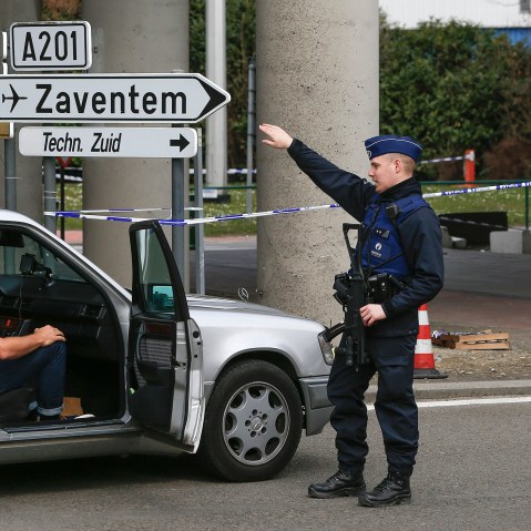 A Belgian police officer controls the access to Belgian international airport of Zaventem airport, in Zaventem, Belgium, April 1, 2016. (Photo by Yves Herman/Reuters)