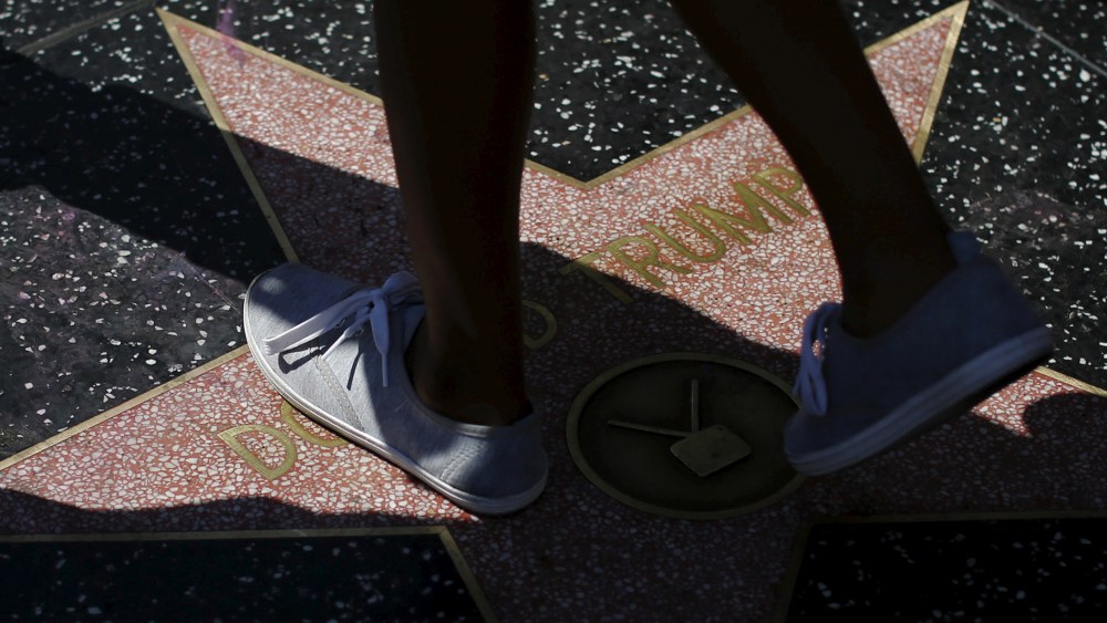People walk on the star of Republican presidential candidate Donald Trump on the Hollywood Walk of Fame in Hollywood, Calif., April 5, 2016. (Photo by Mario Anzuoni/Reuters)