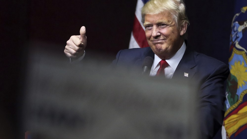 U.S. Republican presidential candidate Donald Trump speaks on stage during campaign event at Grumman Studios in Bethpage, N.Y. on April 6, 2016. (Photo by Carlo Allegri/Reuters)