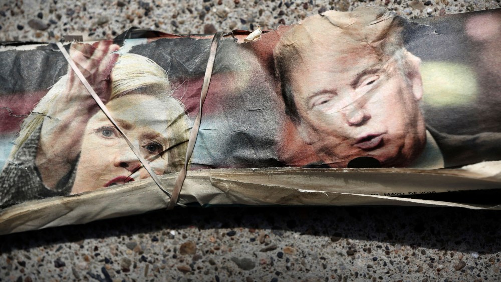 A rubber band wraps the front page of La Opinion newspaper featuring pictures of Democratic Presidential Candidate Hillary Clinton and Republican Presidential Candidate Donald Trump in Santa Ana, Calif., May 15, 2016. (Photo by Patrick T. Fallon/Reuters)