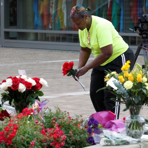 Chelise Stepson lays flowers as she pays her respects to the late Muhammad Ali, the former world heavyweight boxing champion, at the Ali Center court yard in Louisville, Ky., June 4, 2016. (Photo by John Sommers II/Reuters)