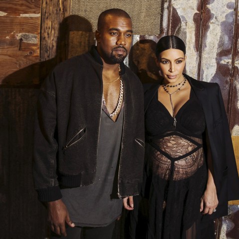 Musician Kanye West stands with his wife Kim Kardashian after watching the Givenchy Spring/Summer 2016 collection during New York Fashion Week, Sep. 11, 2015. (Photo by Lucas Jackson/Reuters)