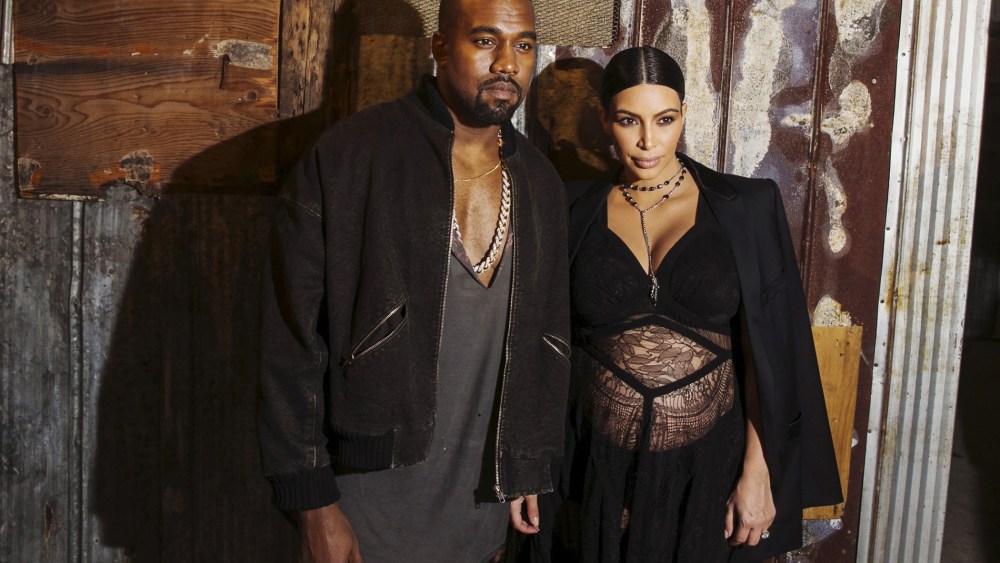 Musician Kanye West stands with his wife Kim Kardashian after watching the Givenchy Spring/Summer 2016 collection during New York Fashion Week, Sep. 11, 2015. (Photo by Lucas Jackson/Reuters)