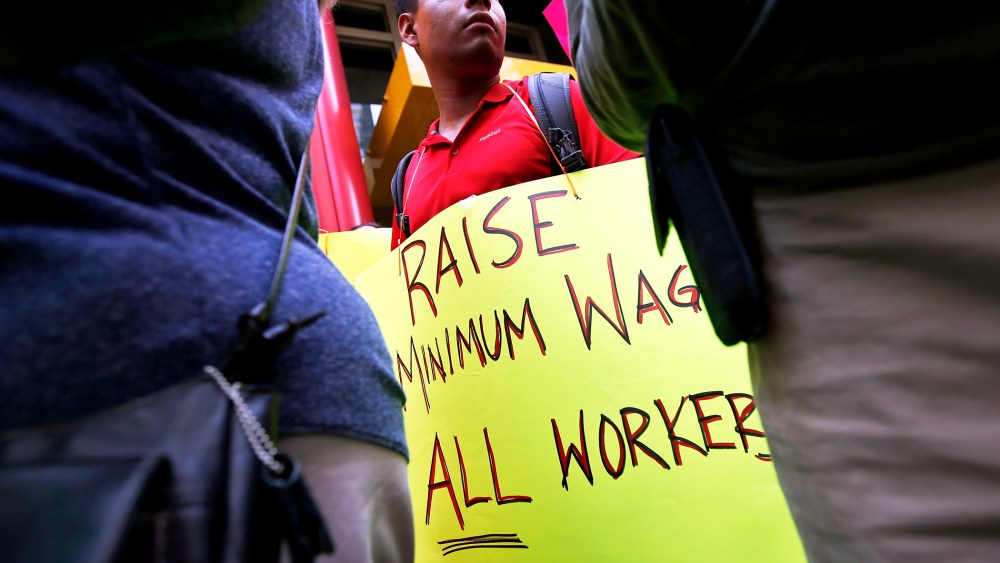Low wage workers take part in a protest organized by the Coalition for a Real Minimum Wage in New York, May 30, 2013.