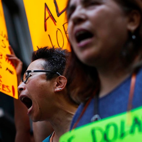 Low wage workers take part in a protest organized by the Coalition for a Real Minimum Wage outside the offices of New York Governor Andrew Cuomo,