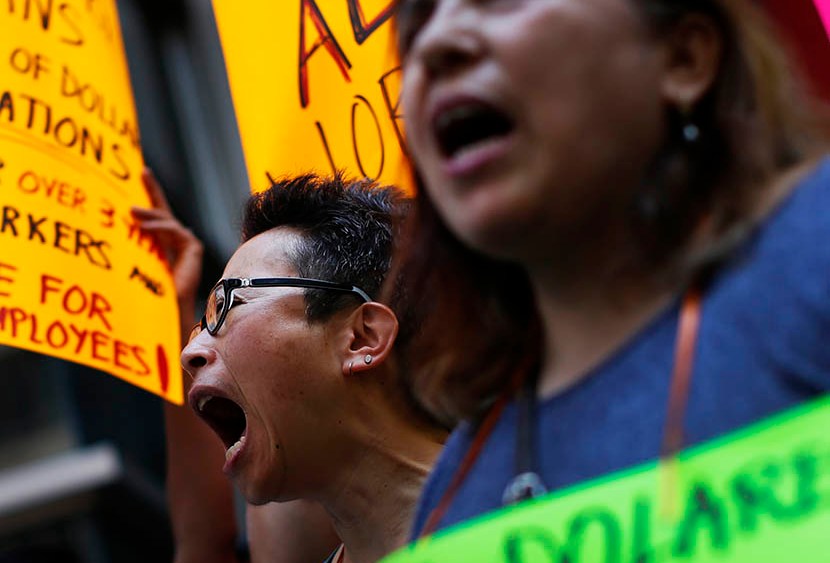 Low wage workers take part in a protest organized by the Coalition for a Real Minimum Wage outside the offices of New York Governor Andrew Cuomo,
