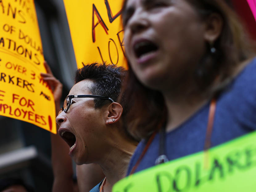 Low wage workers take part in a protest organized by the Coalition for a Real Minimum Wage outside the offices of New York Governor Andrew Cuomo,