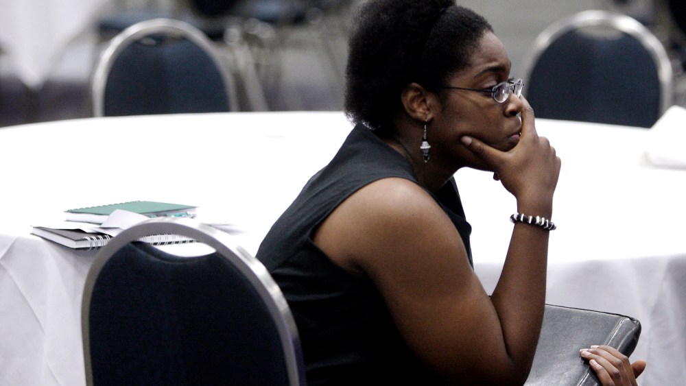 U.S. Air Force veteran Brittany Scott waits to talk to corporate recruiters at a job fair targeting unemployed military veterans in Washington, on June 11, 2013.