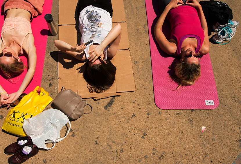 People take part in a group yoga practice on the morning of the summer solstice in New York's Times Square, June 21, 2013. (Photo by Lucas Jackson/Reuters)