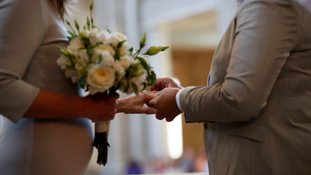 A couple exchange wedding rings at City Hall in San Francisco, on June 28, 2013.