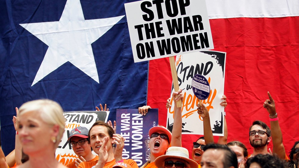 Protesters rally before the start of a special session of the Legislature in Austin, July 1, 2013.