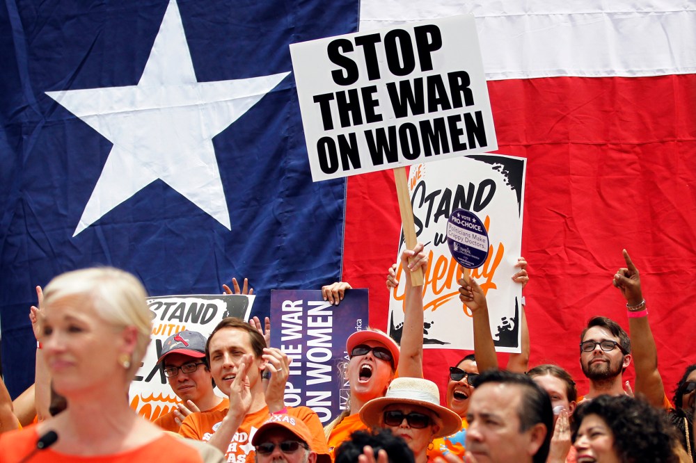 Protesters rally before the start of a special session of the Legislature in Austin, July 1, 2013.