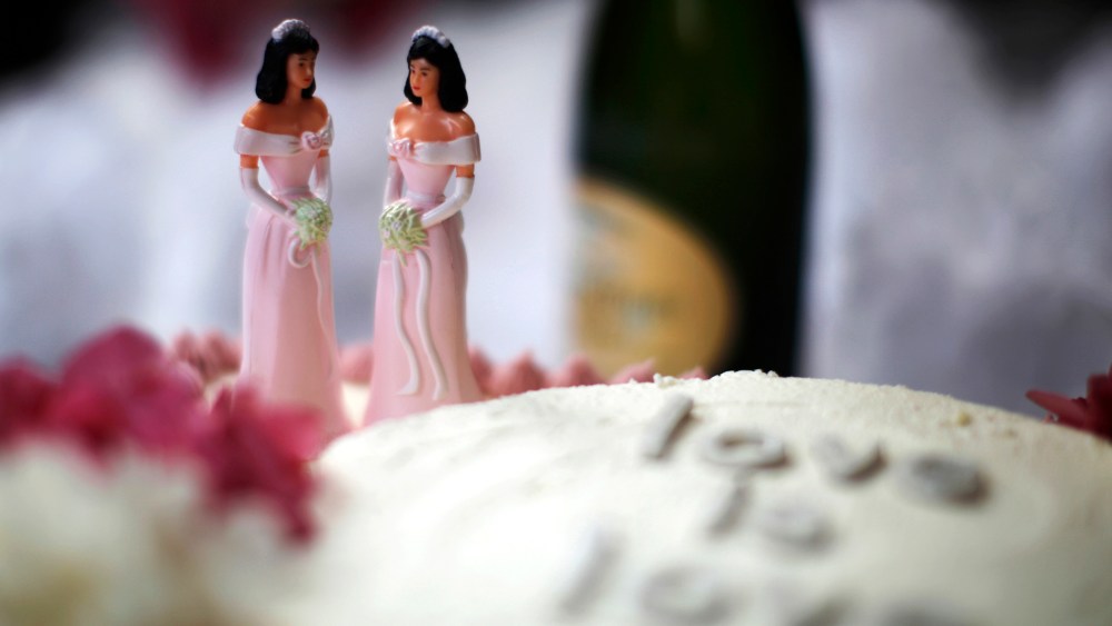 A wedding cake is seen at a reception for same-sex couples.
