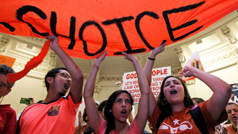 Protesters rally in the rotunda of the State Capitol as the state Senate meets to consider legislation restricting abortion rights in Austin, Texas July 12, 2013.
