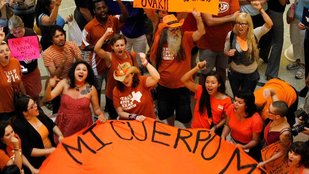 Protesters rally in the rotunda of the State Capitol as the state Senate meets to consider legislation restricting abortion rights in Austin, July 12, 2013.