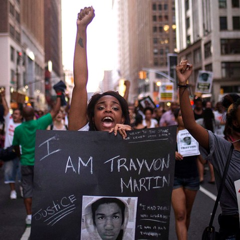 A woman yells slogans with demonstrators supporting Trayvon Martin while marching to Times Square from New York's Union Square on July 14, 2013.  (Photo by Adrees Latif/Reuters)