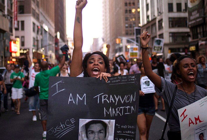 A woman yells slogans with demonstrators supporting Trayvon Martin while marching to Times Square from New York's Union Square on July 14, 2013.  (Photo by Adrees Latif/Reuters)