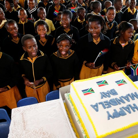 Children sing Happy Birthday to former President Nelson Mandela at a school in Atteridgevile near Pretoria, July 18, 2013. (Photo by Mike Hutchings/Reuters)