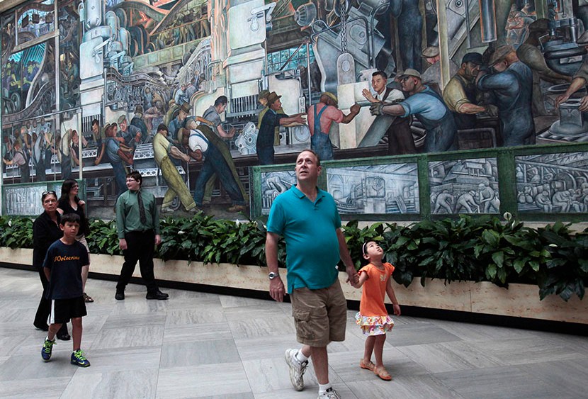 Visitors at the Detroit Institute of Arts museum look at the work by famed muralist Diego Rivera in Detroit, Michigan June 2, 2013. (Photo by Rebecca Cook/Reuters)