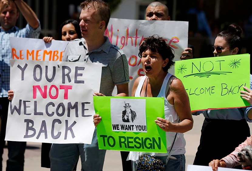 Opponents of San Diego Mayor Filner attend a "Not Welcome Back'' rally in San Diego