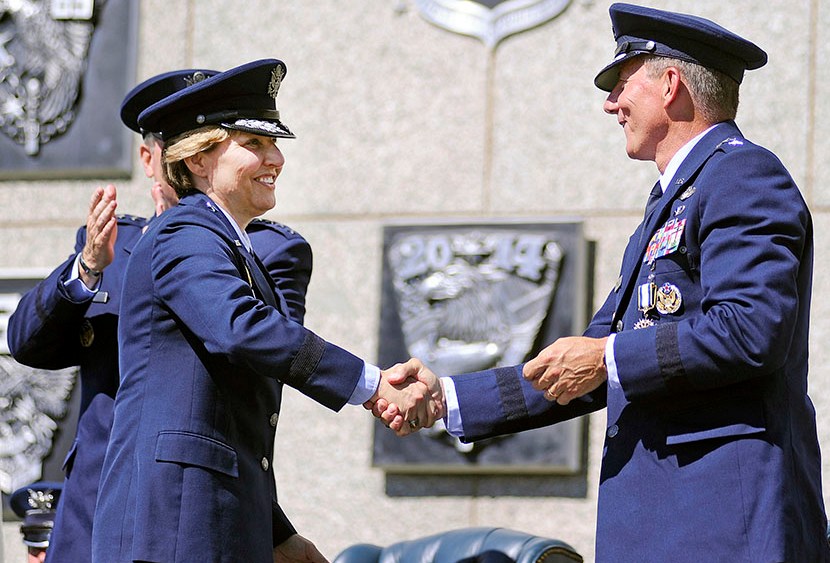 Newly-named superintendent of the United States Air Force Academy Lt. Gen. Michelle Johnson shakes hands with Lt. Gen. Mike Gould after being recognized during a change of command ceremony at the Academy in Colorado, August 12, 2013 (Photo by Sarah...