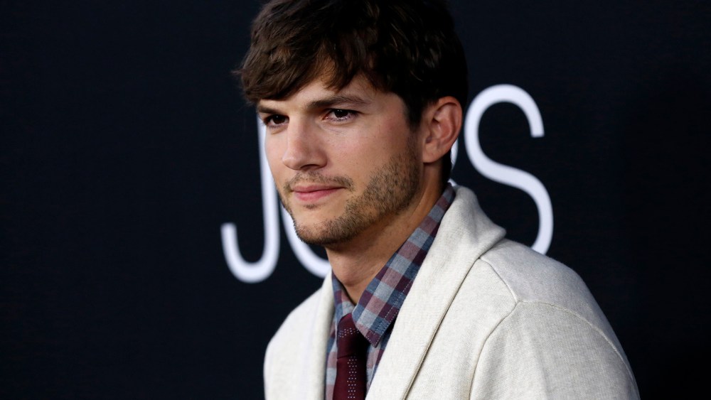 Cast member Ashton Kutcher poses at the premiere of "Jobs" in Los Angeles, Calif on Aug. 13, 2013.