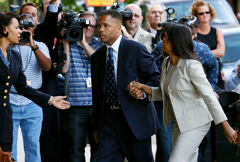 Jesse Jackson Jr. (C) and his wife Sandi (front) arrive in court for their sentencing hearing in Washington, August 14, 2013. (Photo by Kevin Lamarque/Reuters)